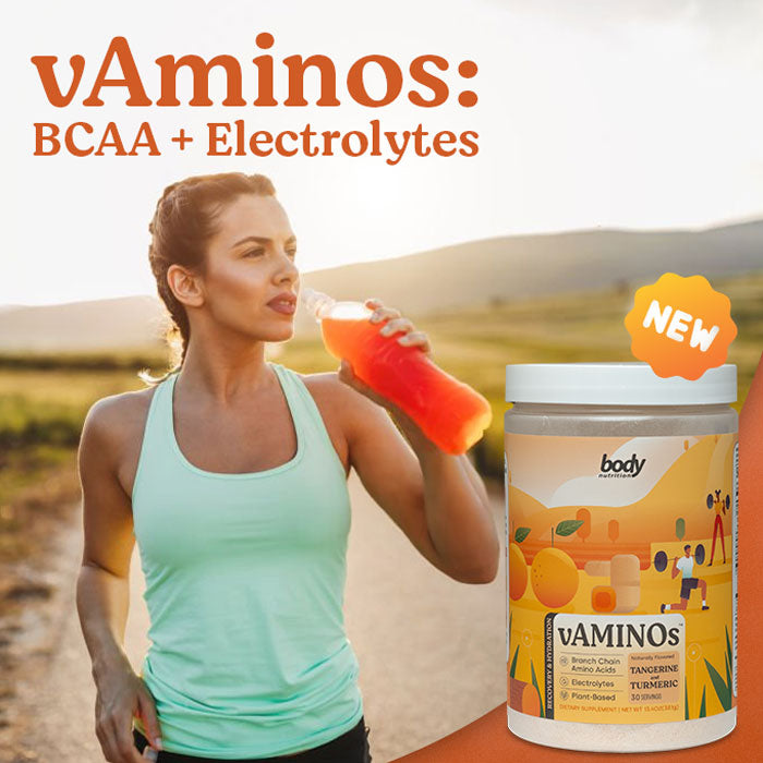 woman drinking vaminos